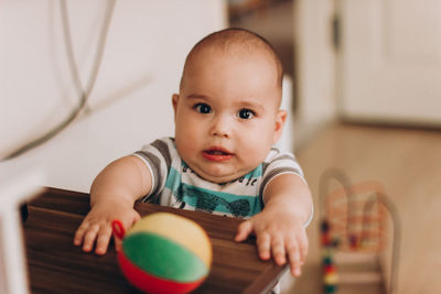 Portrait of cute baby girl at home