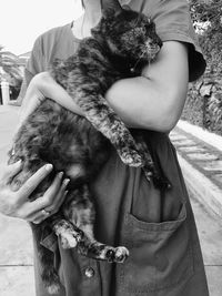 Close-up of woman holding dog