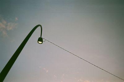 Low angle view of street light against sky