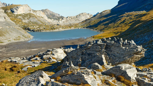 Scenic view of rocks and mountains against sky