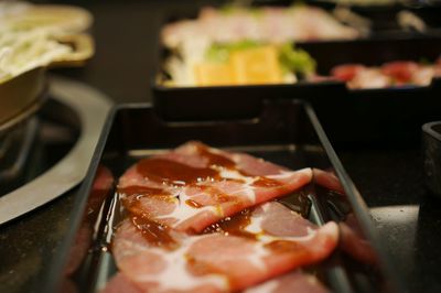 High angle view of meat in cooking pan