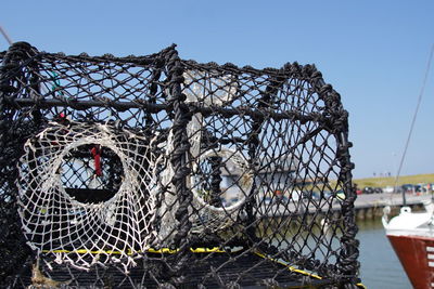 Fishing net against clear sky