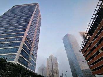 Low angle view of modern buildings against clear sky