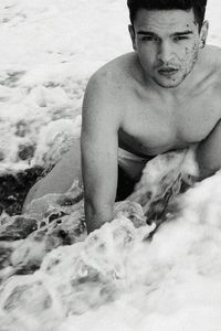 Portrait of shirtless man in water