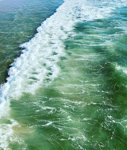 High angle view of water flowing in sea