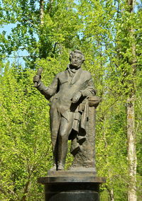 Low angle view of statue against trees