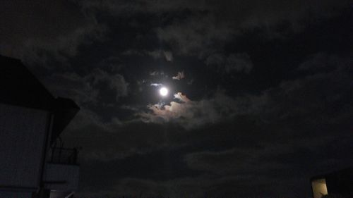 Low angle view of moon against sky at night