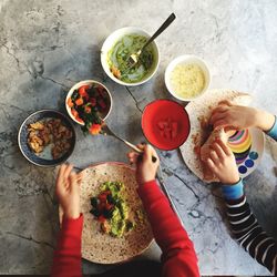 High angle view of people having meal at table