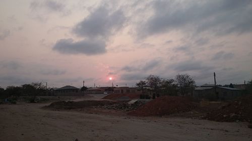 Scenic view of landscape against cloudy sky