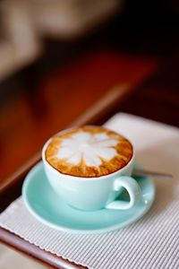 High angle view of coffee cup on table