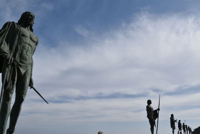 Low angle view of statue against sky