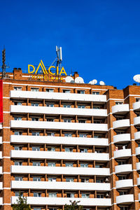 Low angle view of building against blue sky