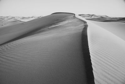 Close-up of sand dunes against sky