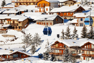 Houses by snow covered town