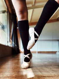 Low section of ballet dancer in studio