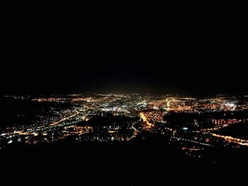 Aerial view of illuminated cityscape at night