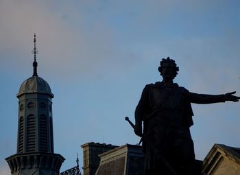 Low angle view of statue against sky