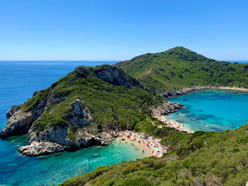 Scenic view of sea against clear blue sky