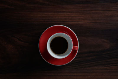 High angle view of coffee cup on table