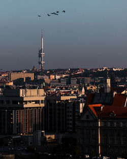 View of buildings in city against sky