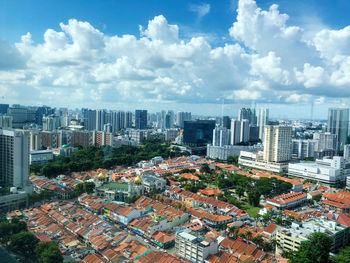 High angle view of modern buildings in city against sky