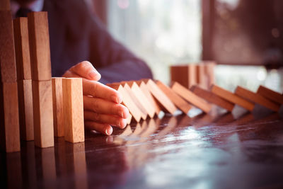 Close-up of man playing with ball on table