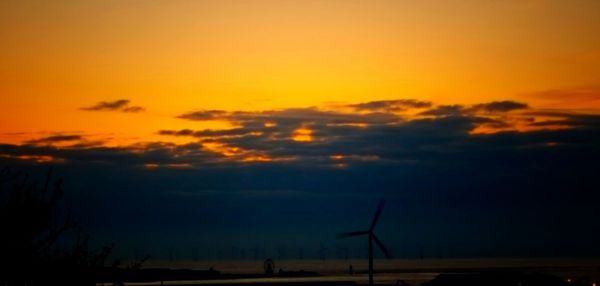 Scenic view of silhouette landscape against sky during sunset