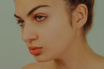 Close-up portrait of a serious young woman