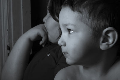 Close-up portrait of cute boy at home