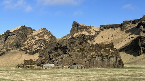 Panoramic view of rocky mountains against sky