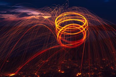 Light painting against sky at night