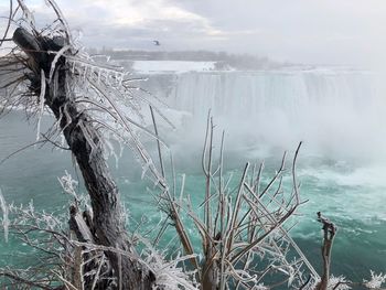 Scenic view of frozen lake against sky