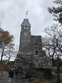 Low angle view of building against cloudy sky