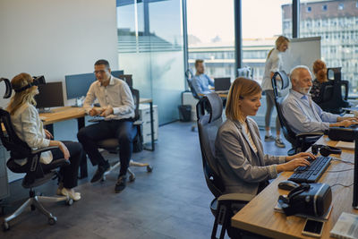 Colleagues working in office