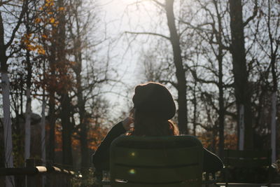 Rear view of silhouette couple against trees