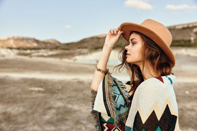 Young woman wearing hat