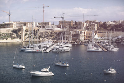 Boats moored at harbor