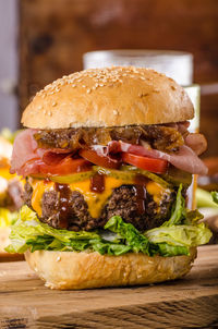 Close-up of burger on serving board at table