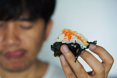 Close-up of man holding ice cream