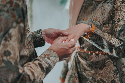 Midsection of woman hand with umbrella