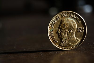 Close-up of coin on table