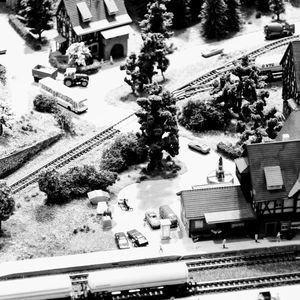 High angle view of cars on railroad tracks in city