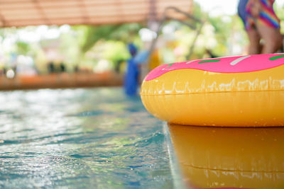 Close-up of inflatable ring by swimming pool