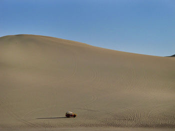 Scenic view of desert against clear sky