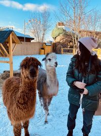 Friends standing in snow