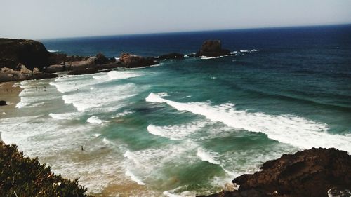 Scenic view of sea against cloudy sky