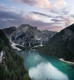 Scenic view of lake and mountains against sky