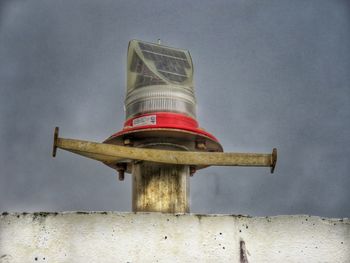 Low angle view of traditional windmill against sky