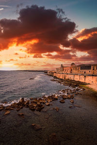 Scenic view of sea against sky during sunset