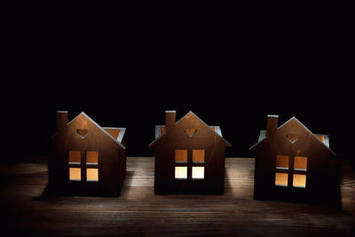 Houses against sky at night